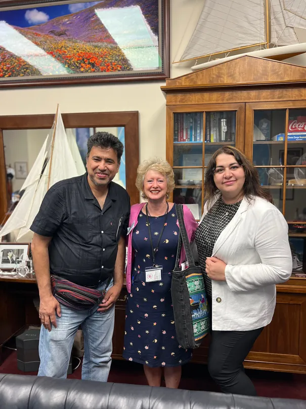 Three people from FIRM standing together in a congressional office in Washington, D.C.